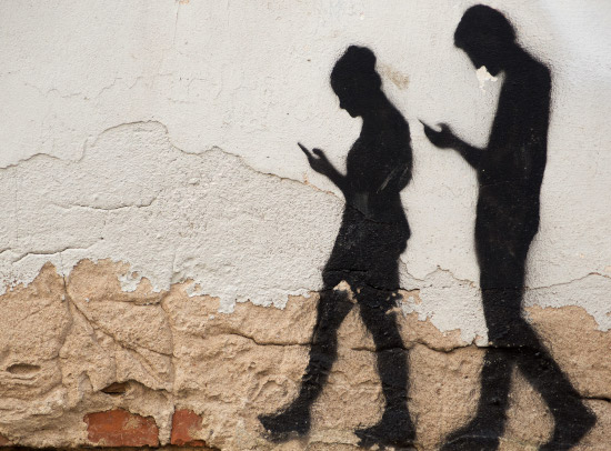 Walking With Mobile Phone. Street wall art. Domeinu Publikoa.